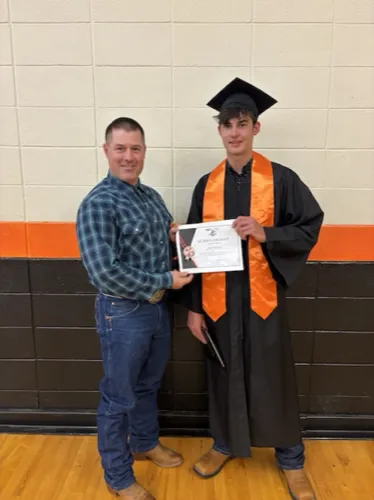 Jake Hendrix receiving the Donnelly Snowmobile Club scholarship.
